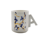 Taza de porcelana modelo caritas blanca Mo Import